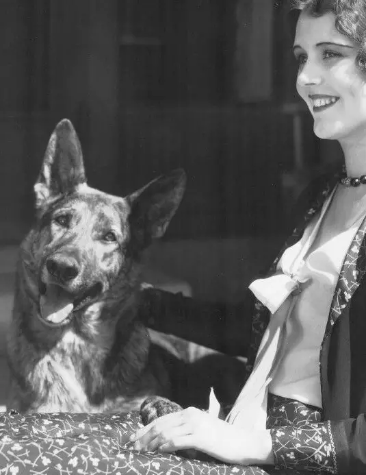 BEAUTIFUL JUNE COLLYER AT HOME WITH HER GERMAN SHEPHERD DOG